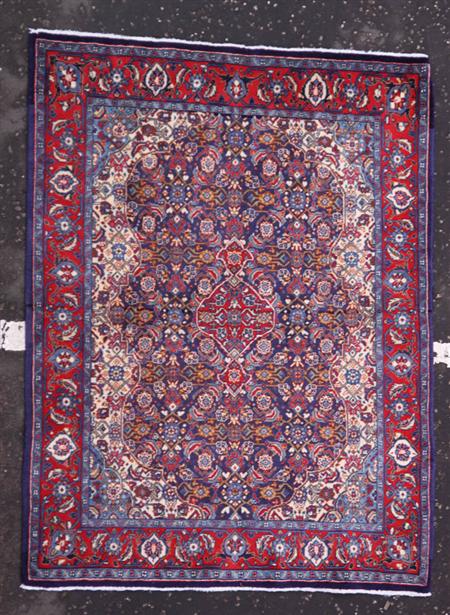 Appraisal: A Northwest Persian rug modern the indigo field with red