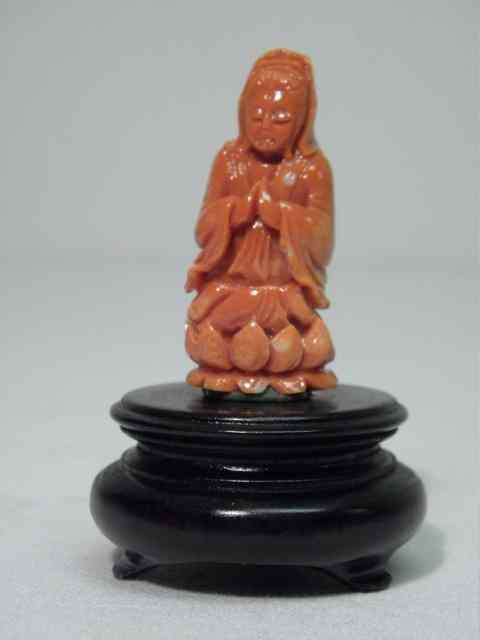 Appraisal: Chinese carved coral miniature figurine depicting Guanyin praying upon a