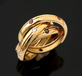 Appraisal: A Cartier Trinity ring The ct gold interlinked bands set