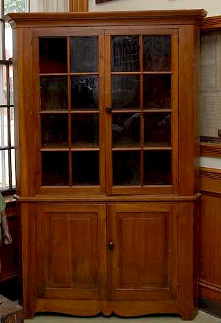 Appraisal: 's Walnut Pane Corner Cupboard 's Walnut Raised Panel pane