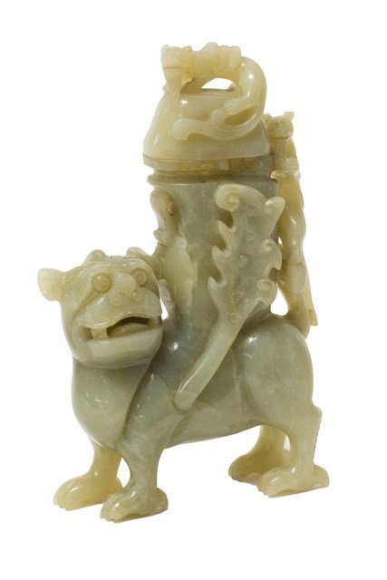 Appraisal: A Chinese mottled celadon jade Buddhist lion vase and cover