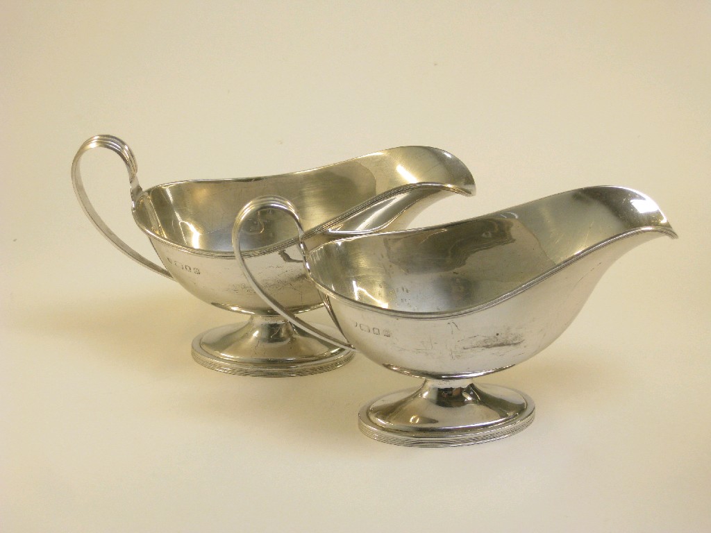 Appraisal: Pair of George V oval Sauce Boats on pedestal bases