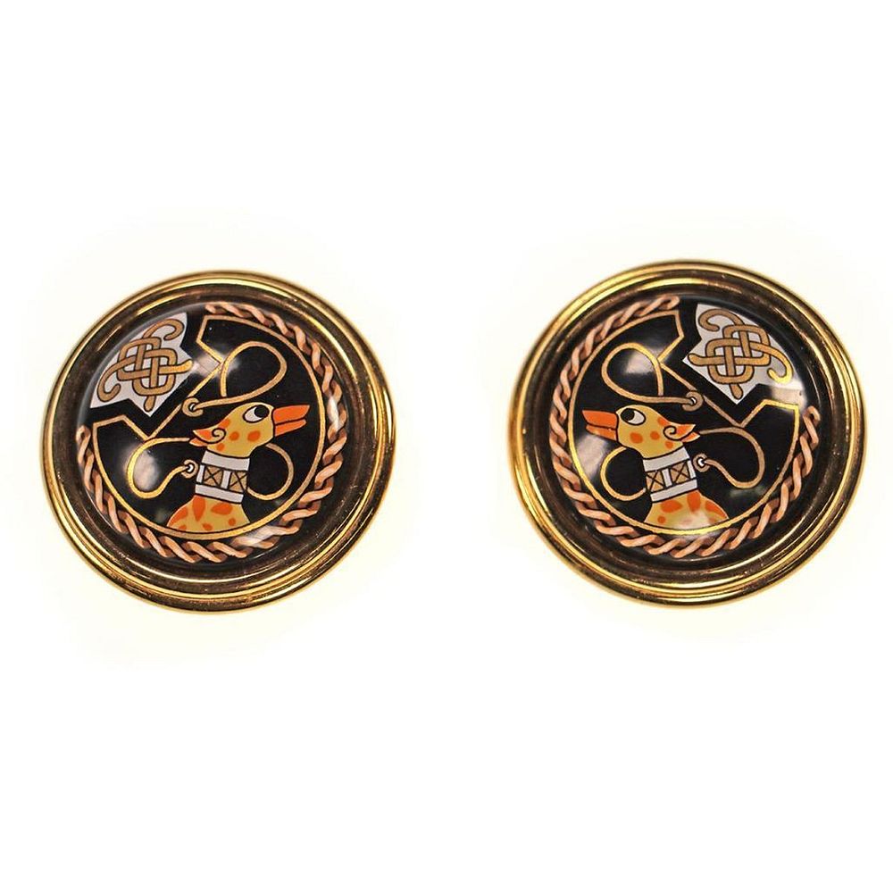 Appraisal: Hermes gold tone enamel clip earrings circular with -inch diameter