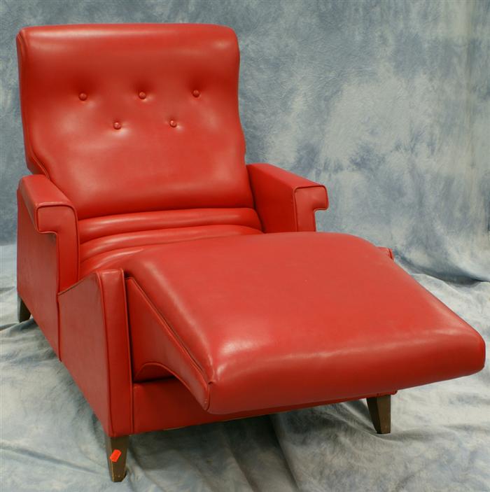 Appraisal: Red contour lounge chair upholstered in red leather fabric paper