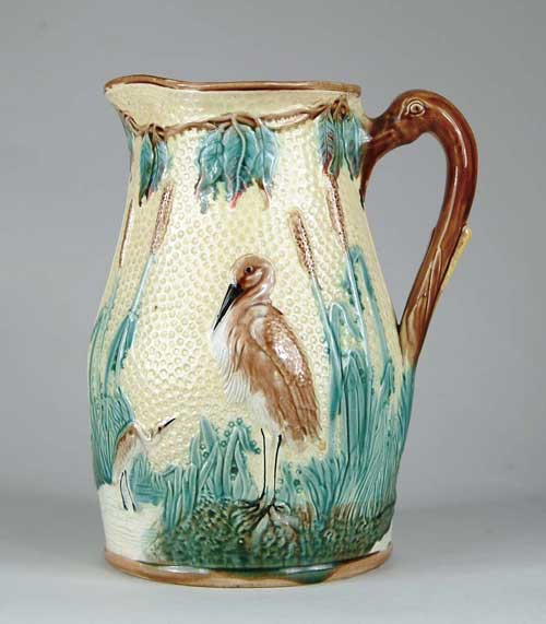 Appraisal: OUTSTANDING OVERSIZED MAJOLICA PITCHER WITH STORKS Interesting swan neck handle