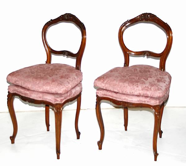 Appraisal: A pair of Louis XV style carved walnut and upholstered