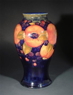 Appraisal: Pomegranate' a Moorcroft Pottery baluster vase designed by William Moorcroft