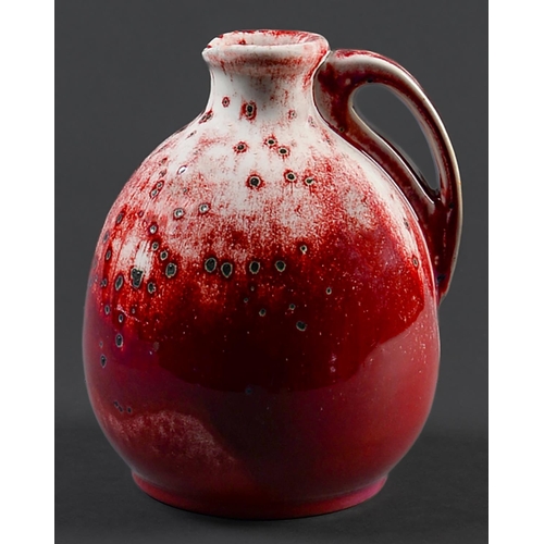 Appraisal: A Ruskin flamb ewer of onion form the rich crimson