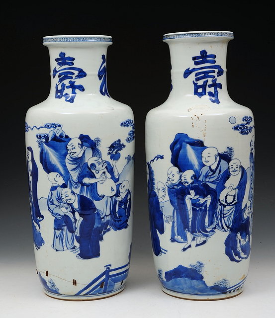 Appraisal: A PAIR OF BLUE AND WHITE ROULEAU VASES painted with