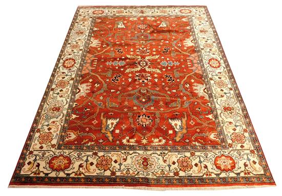 Appraisal: RUG Serapi brick field ensconced by cream turtle palmette border