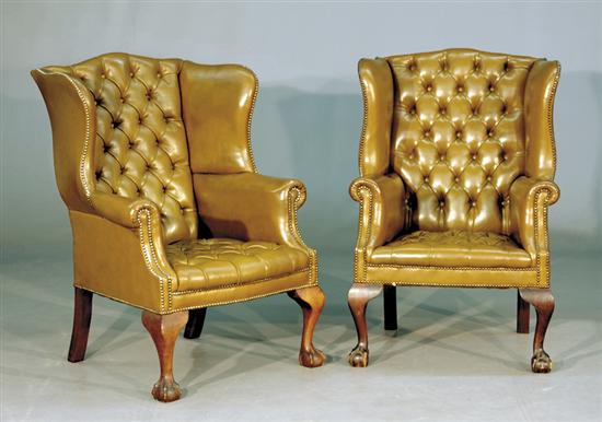 Appraisal: Pair Georgian style olive leather and mahogany wing chairs late