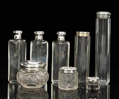 Appraisal: A Collection of British Glass Containers with Sterling Silver Lids