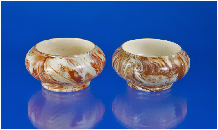 Appraisal: Macintyre Pair of Agate Design Slipware Salts inches in height