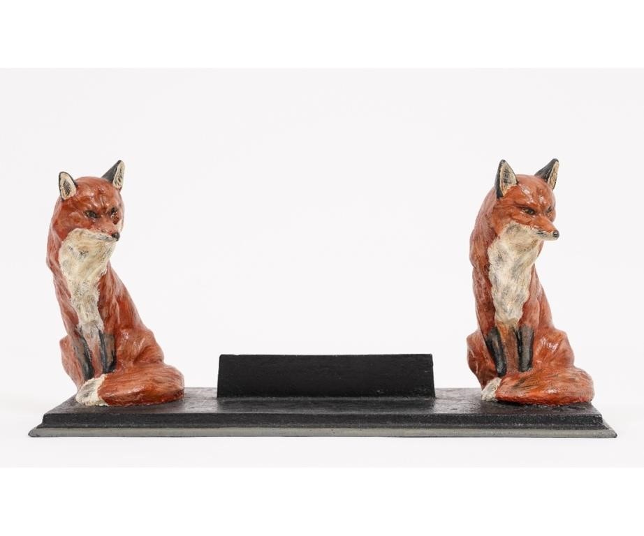 Appraisal: Cast iron metal boot scrape with two painted seated foxes