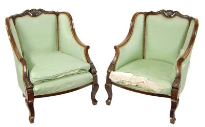 Appraisal: A pair of carved mahogany armchairs upholstered green silk on