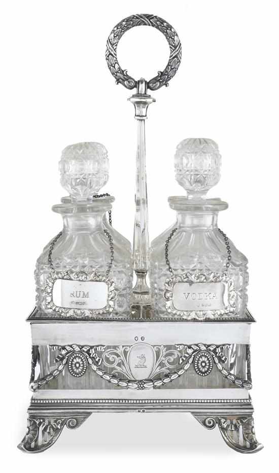 Appraisal: A VICTORIAN STERLING SILVER TANTALUS AND FOUR DECANTERS MAKER'S MARK