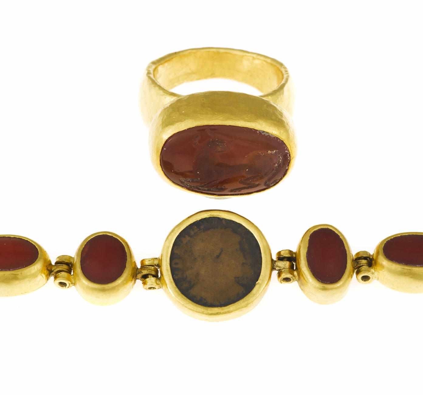 Appraisal: A coin coral and emerald bracelet together with an intaglio