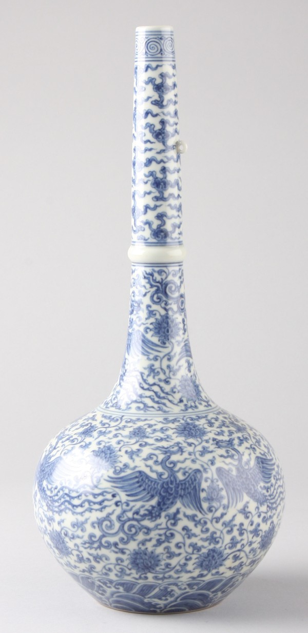 Appraisal: Tall necked vase features white ground with blue chrysanthemum bird