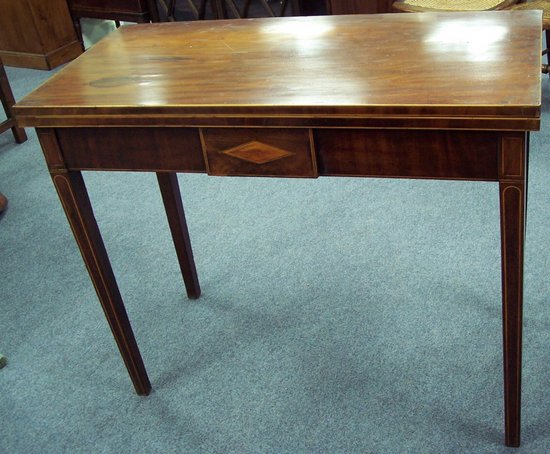 Appraisal: A George III mahogany tea table with folding top raised