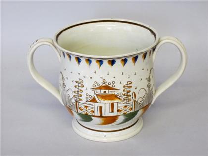 Appraisal: English creamware polychrome decorated twin-handled cup th th century