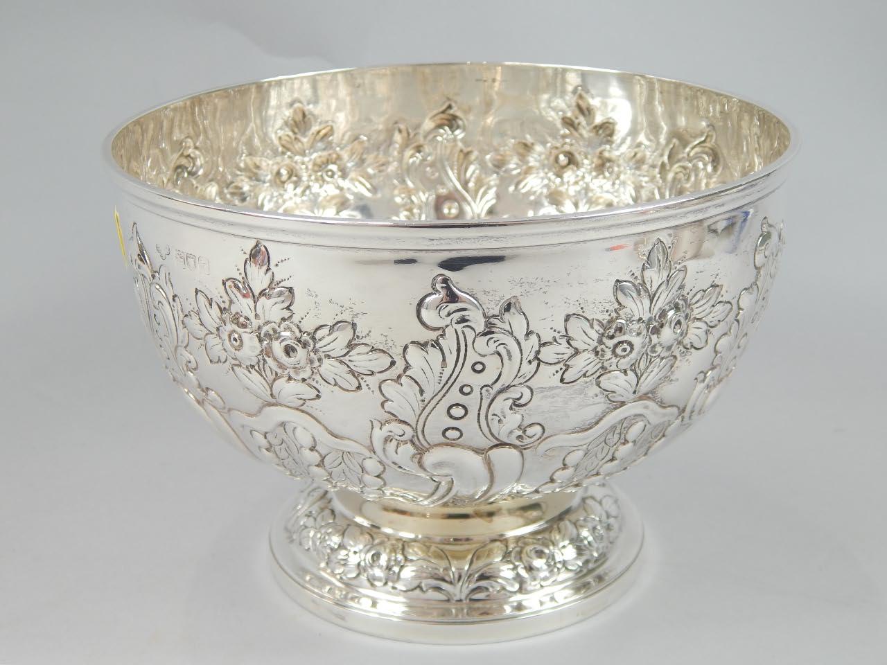 Appraisal: An Edwardian silver Montieth bowl the circular bowl repousse decorated