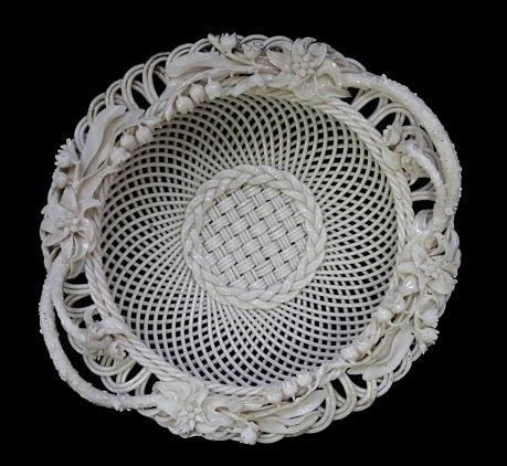 Appraisal: A Belleek Sydenham Twig circular two-handled basket with three-strand weave