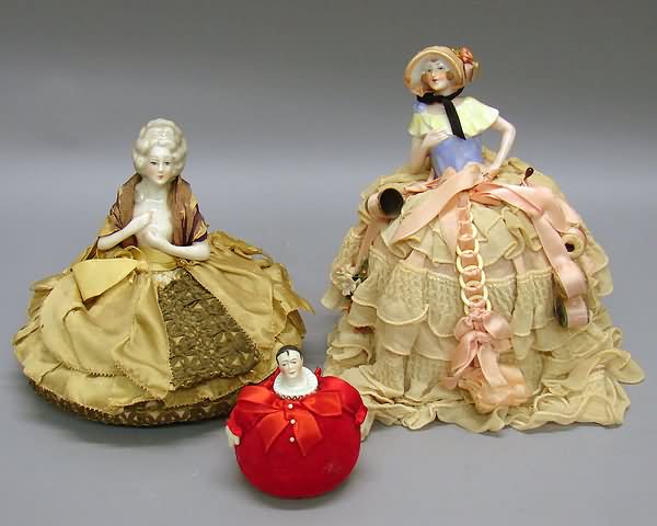 Appraisal: China pin cushion half dolls Pierotte head mounted on a