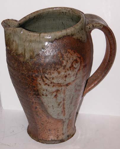 Appraisal: Two Glazed Ceramic Pitchers Artist th Century Studio Ceramicist Date