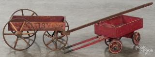 Appraisal: Two painted wood child's pull wagons retaining a red surface