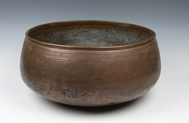 Appraisal: A LARGE MAMLUK CIRCULAR COPPER BOWL decorated with lattice and