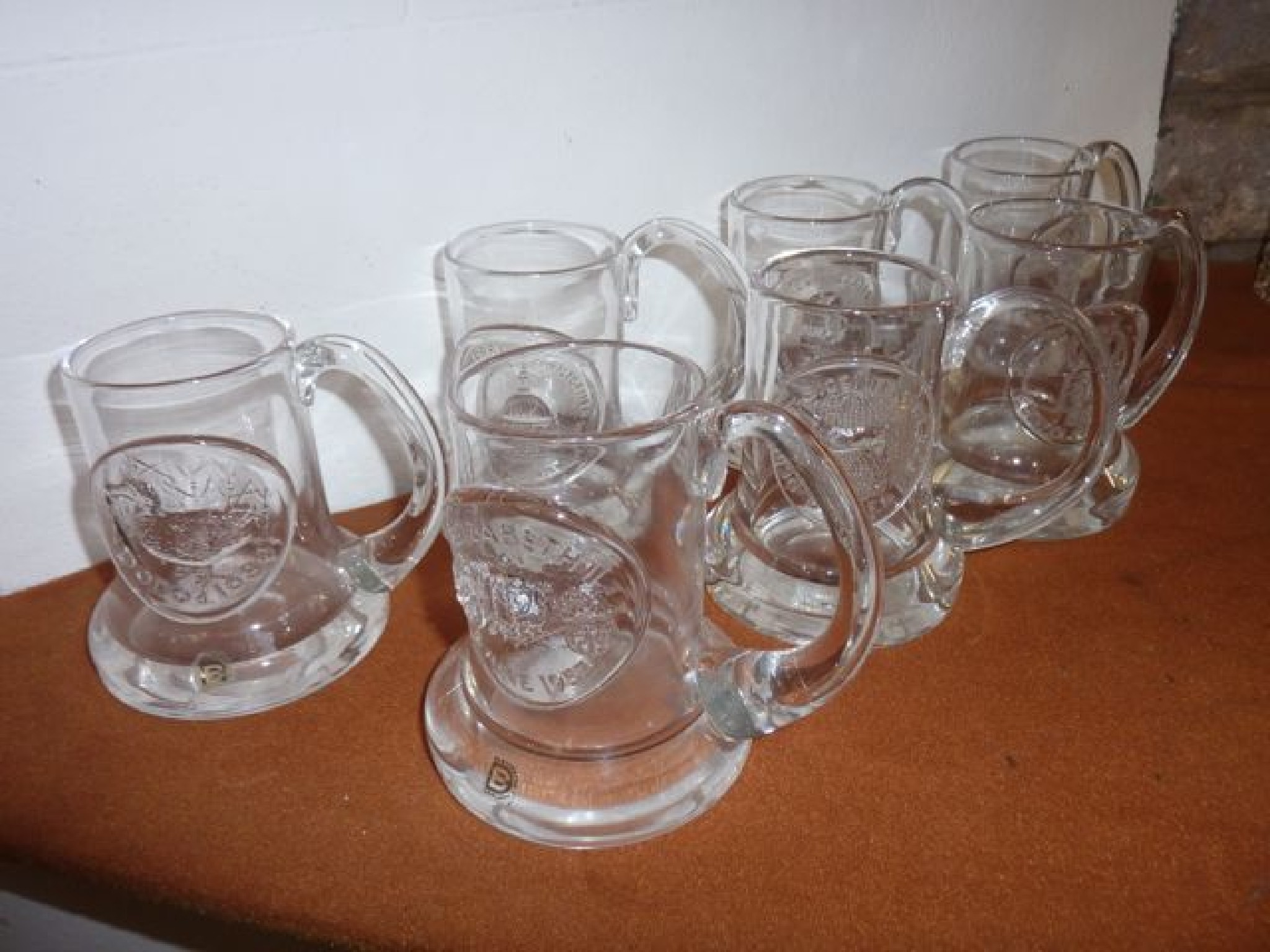 Appraisal: A selection of seven Dartington Crystal tankards all with plaques