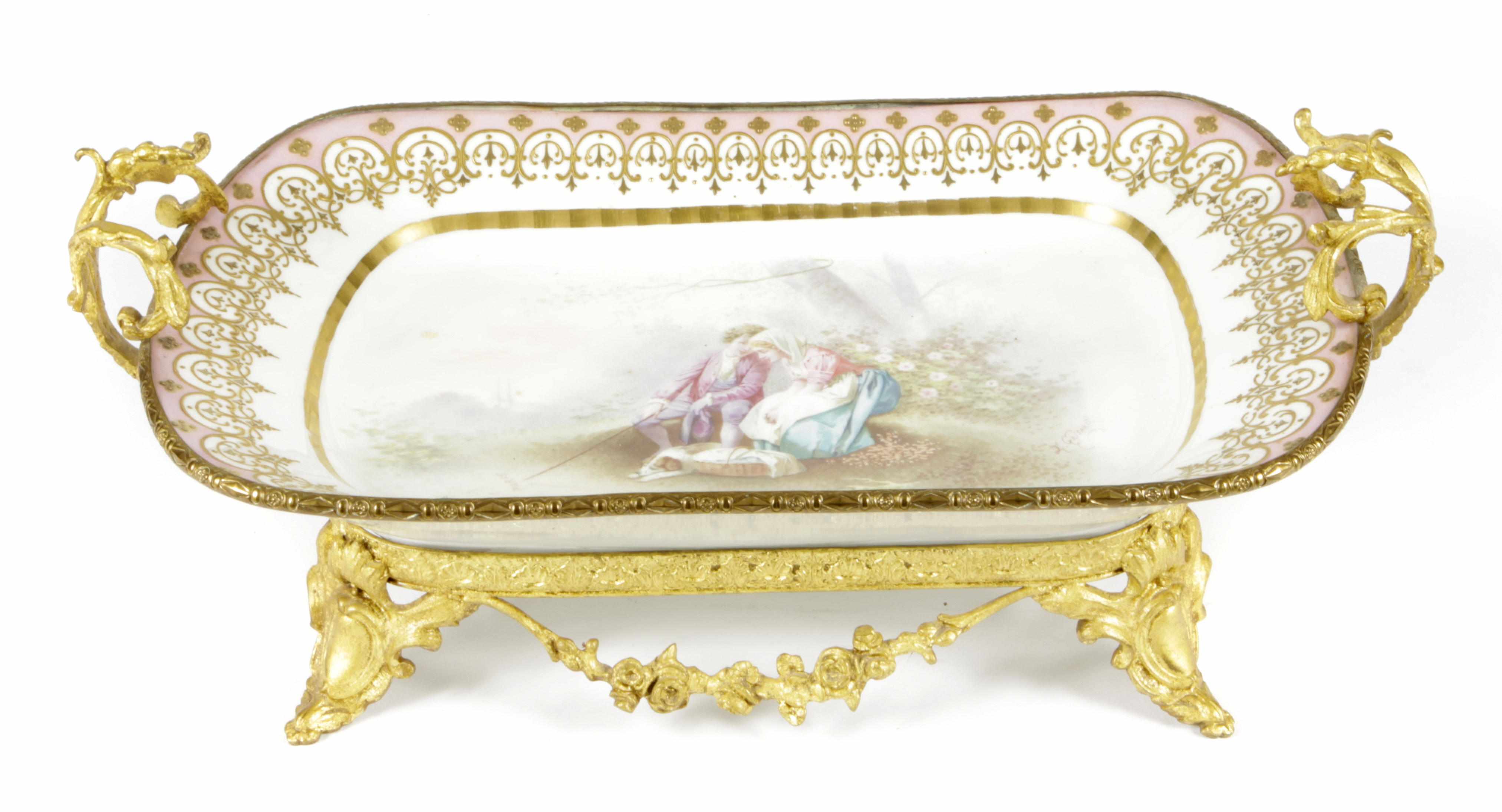 Appraisal: A Sevres style gilt bronze mounted center bowl Painted with