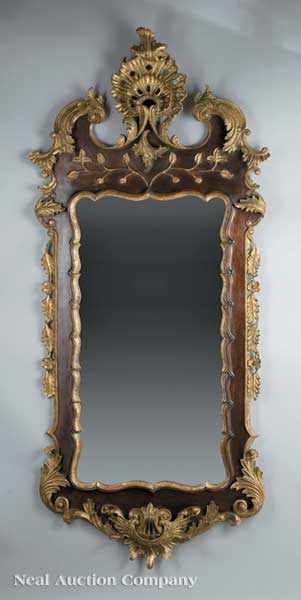 Appraisal: A Rococo-Style Parcel Gilt and Mahogany Mirror crest with a