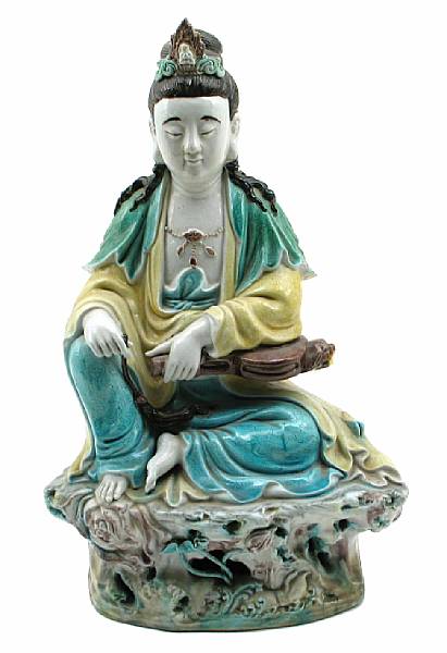 Appraisal: A Chinese glazed biscuit seated guanyin height in