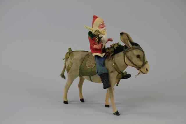 Appraisal: LARGE DONKEY WITH SANTA CANDY CONTAINER Large donkey with green