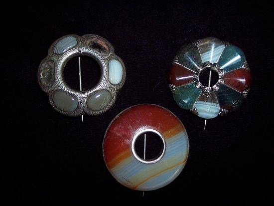 Appraisal: A Scottish pebble brooch of circular hexafoil design set grey