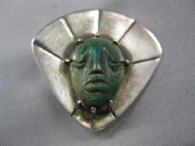 Appraisal: Sterling Carved Stone Brooch Aztec face by Winfred Clark Shaw