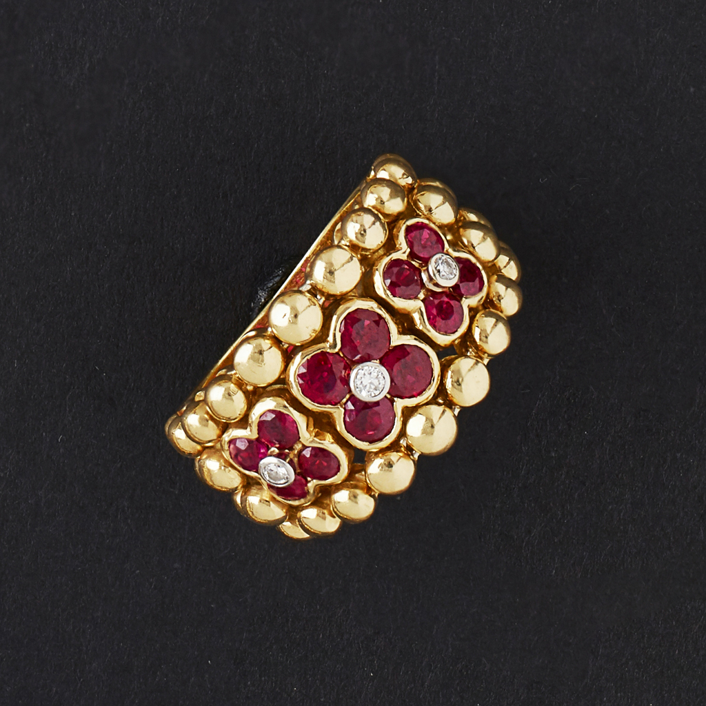 Appraisal: MOUAWAD - A ruby and diamond set ringof broad beaded