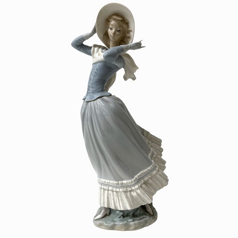 Appraisal: Lladro Porcelain Figurine of Woman in White Sunhat Lladro Porcelain