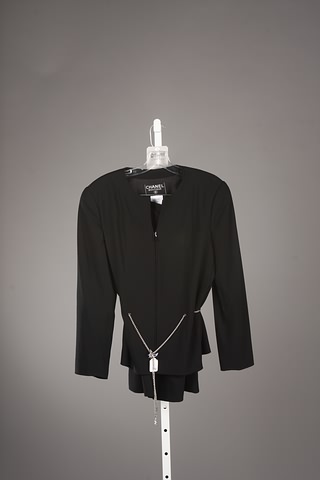 Appraisal: Chanel black skirt suit with signature Chanel chain belt Approx