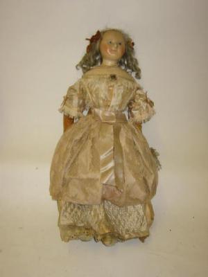 Appraisal: A wax shoulder head girl doll with fixed blue glass