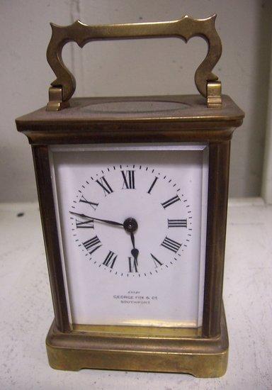 Appraisal: A brass cased carriage clock the enamel dial with Roman