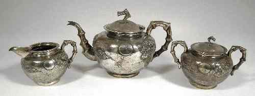 Appraisal: A Chinese silvery metal three piece tea service the spherical