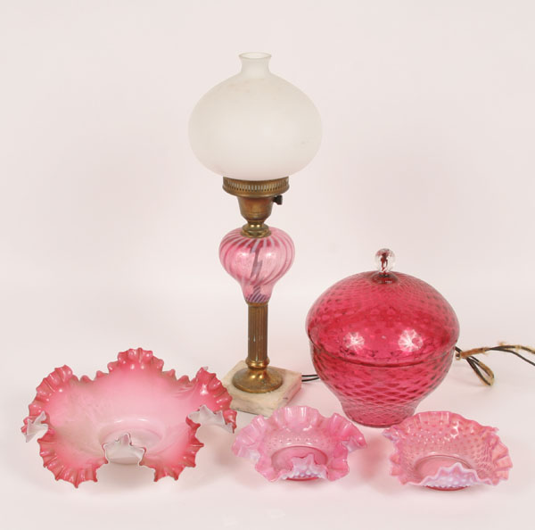 Appraisal: Cranberry glass articles including three ruffled edge bowls dishes one