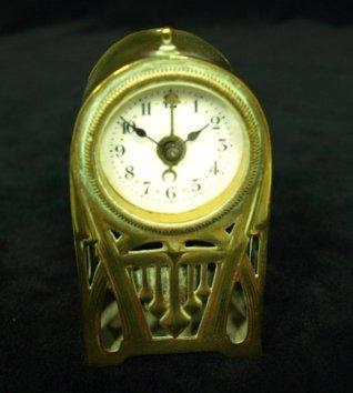 Appraisal: A German miniature mantel clock in a pierced brass case