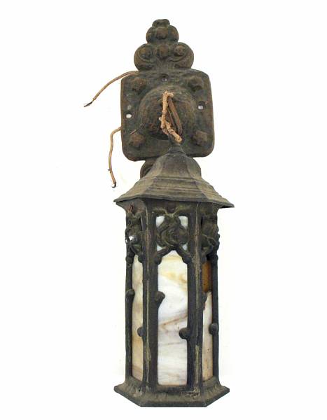 Appraisal: An Art Nouveau patinated metal and slag glass wall light