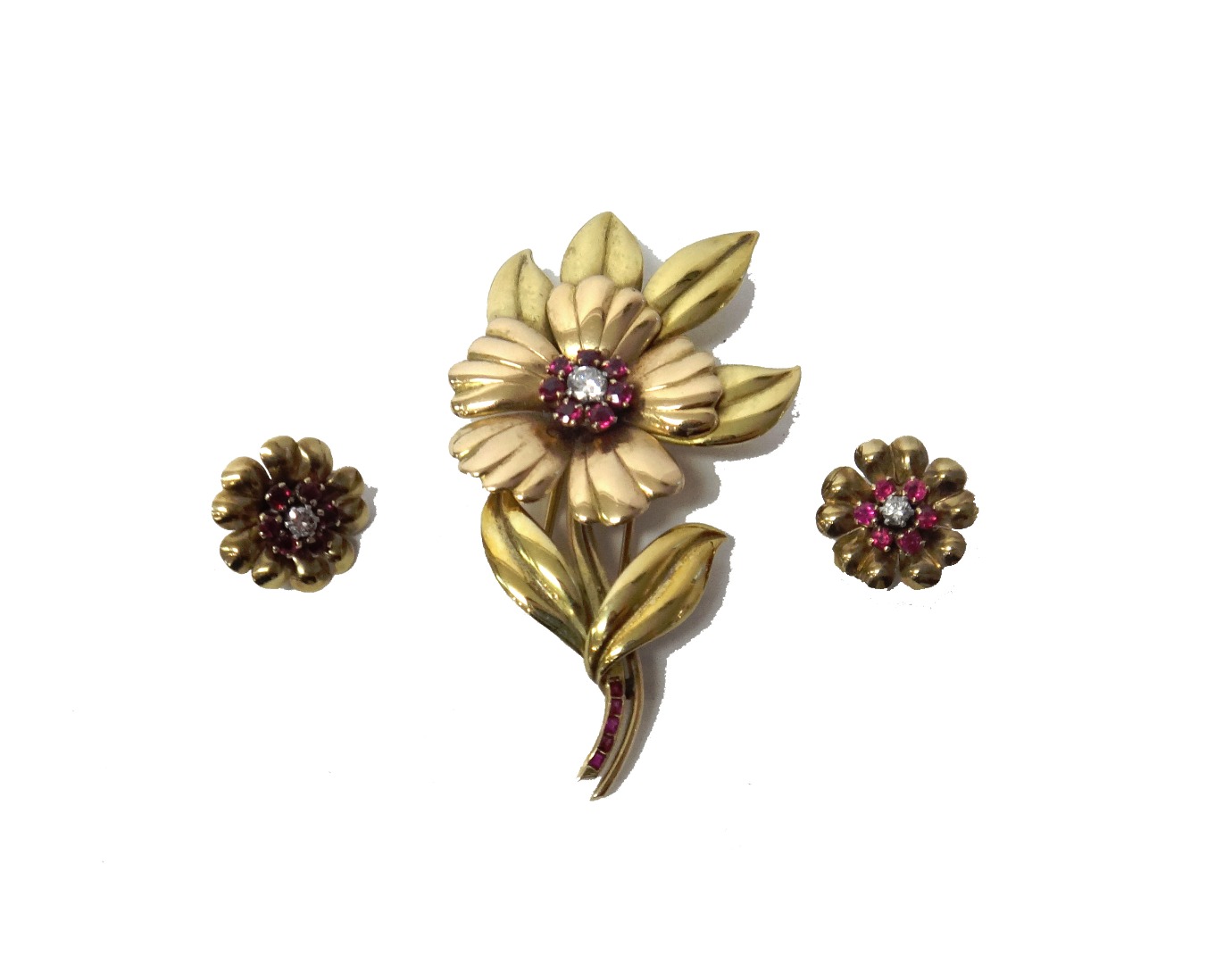 Appraisal: A two colour gold ruby and diamond set brooch designed