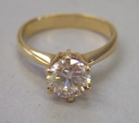 Appraisal: A diamond set single stone ring claw set with a