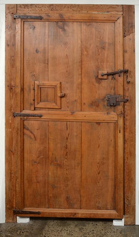 Appraisal: A SPANISH PINE DOOR rectangular with geometric moulded panels and