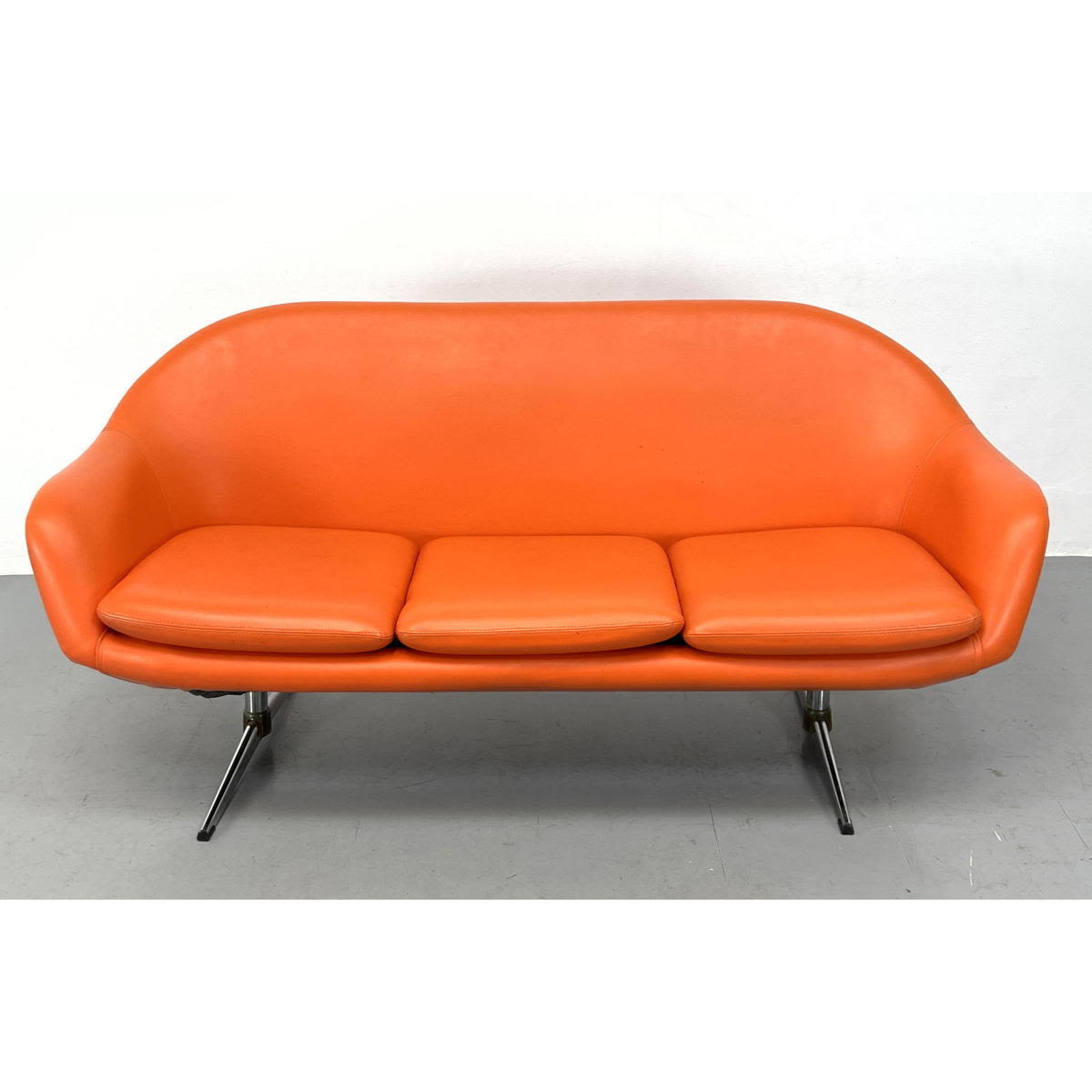 Appraisal: Overman Orange Vinyl Modernist Sofa Couch Chrome Reverse T Legs